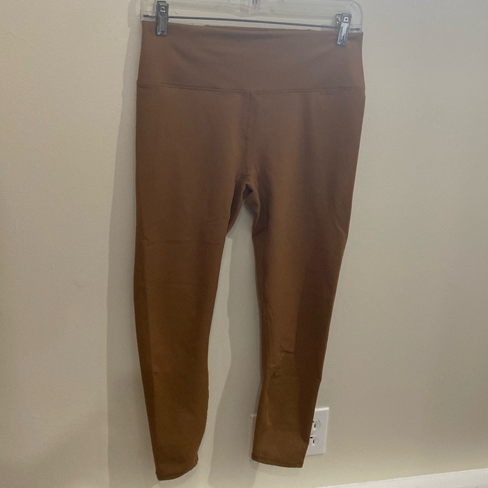 Women’s Fabletics Powerhold leggings, size medium. Color is “autumn/oats”
